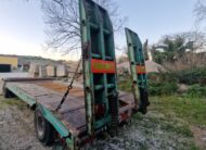 Rimorchio 2 assi CTC verde con rampe a molla posteriori per trasporto macchinari industriali