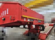 Semirimorchio rosso carrellone Goldhofer 4 assi con vasca culla allungabile e collo staccabile