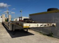 Alt: Semirimorchio carrellone con rampe allungabile De Angelis esteso 19 metri